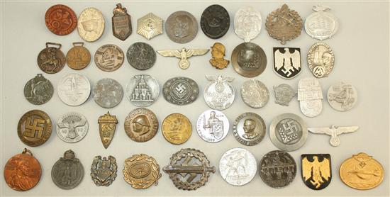 A large collection of various German Third Reich badges,